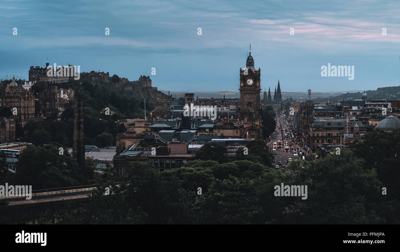 Evening panorama of the city Edinburgh, view of the clock tower and Princes Street and Edinburgh Castle, Edinburgh, Scotland, United Kingdom Stock Photo