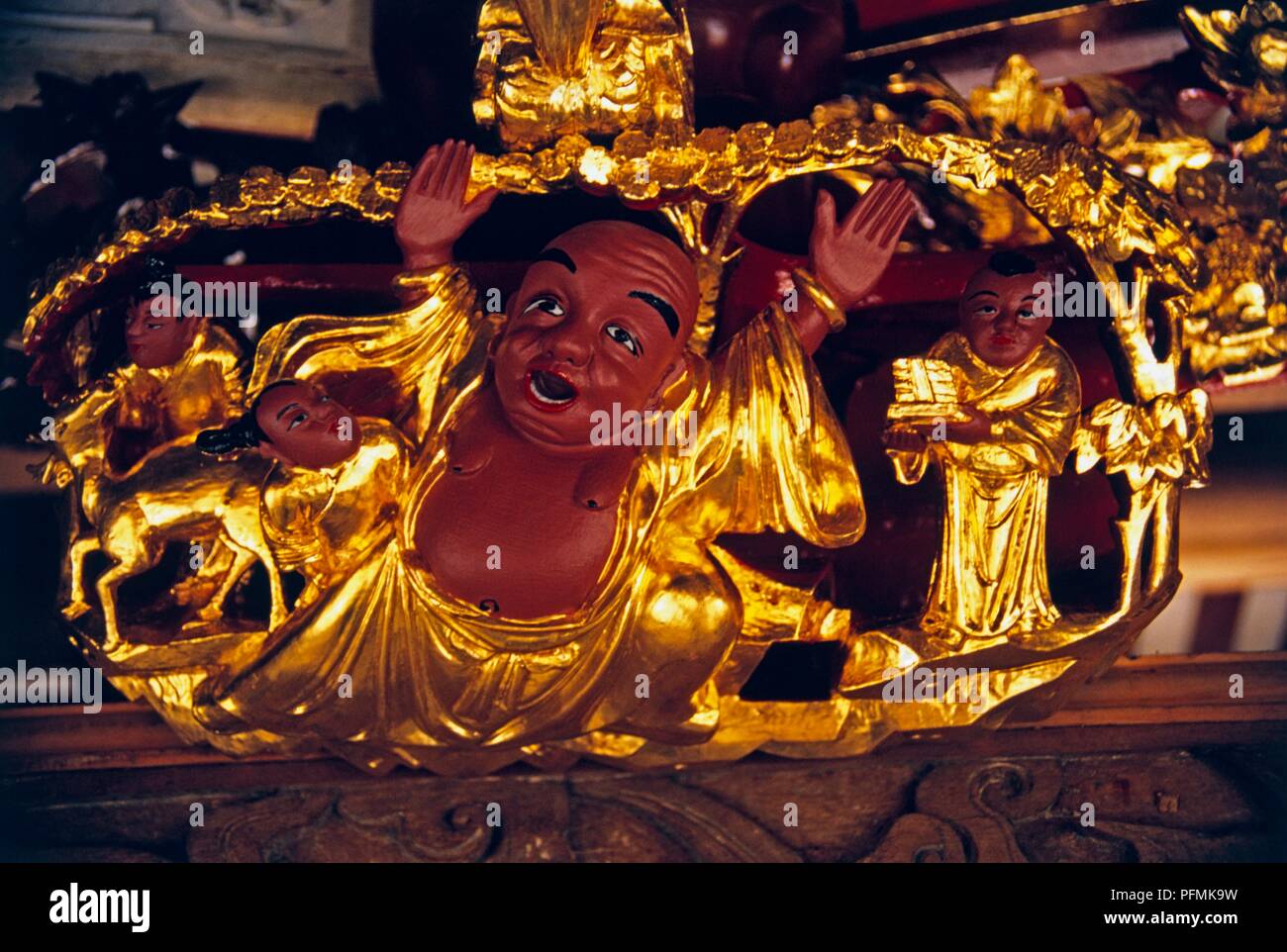 Singapore, Singapore City, Thian Hock Keng Temple, carving of a gilded Buddha Stock Photo