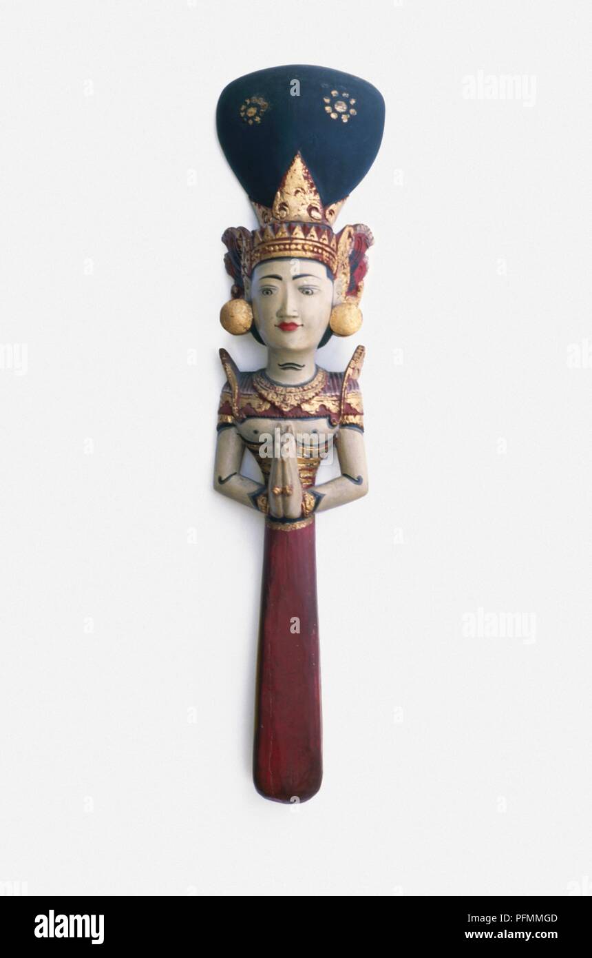 Carved figurine of Balinese rice goddess Stock Photo