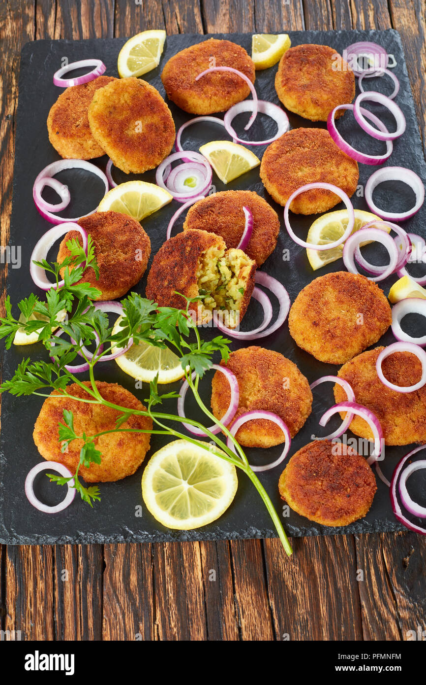delicious crispy rice cutlets with crumbled paneer cheese and finely