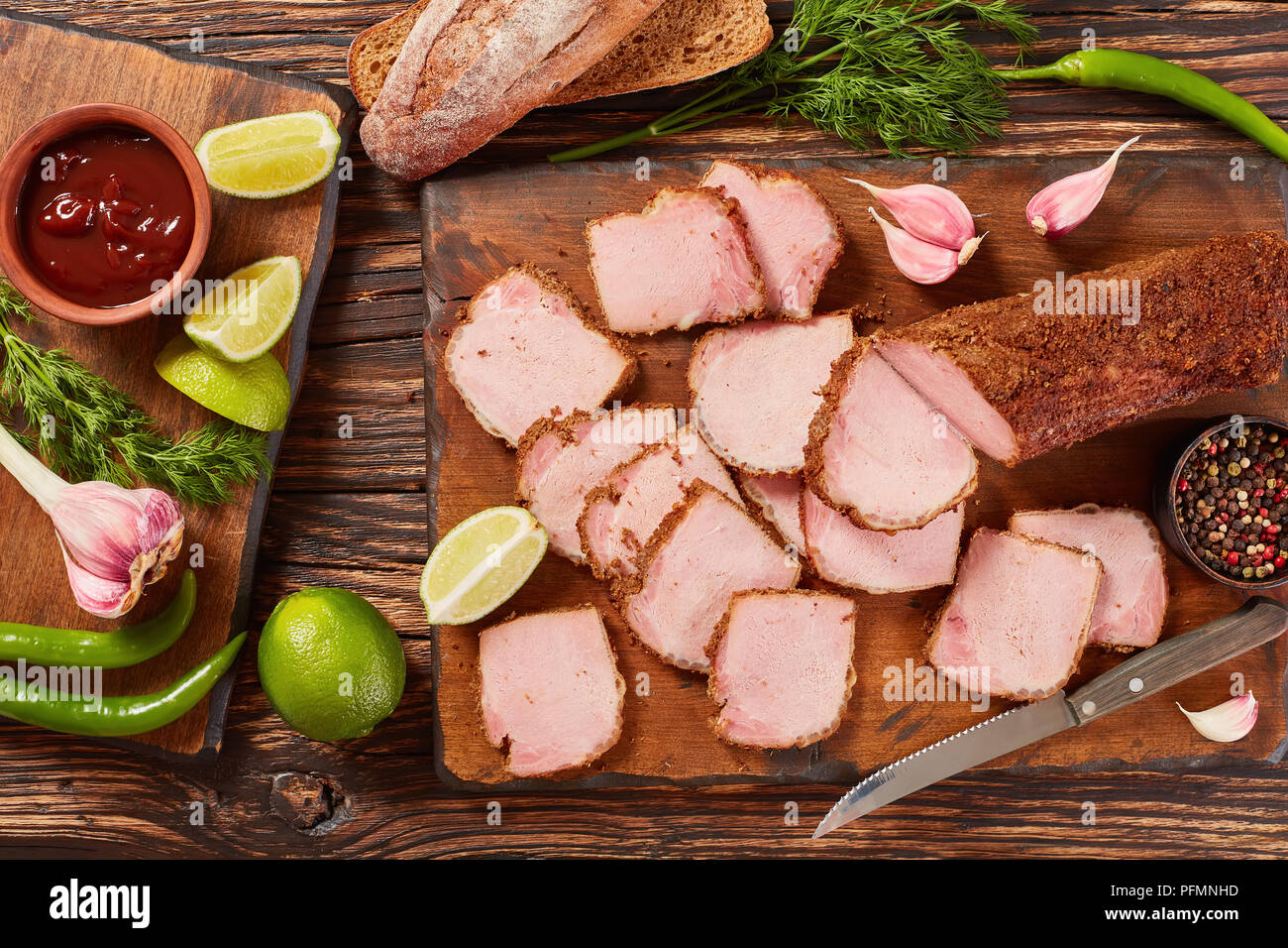 delicious sliced ham seasoned with ground spices served on wooden cutting board with barbecue