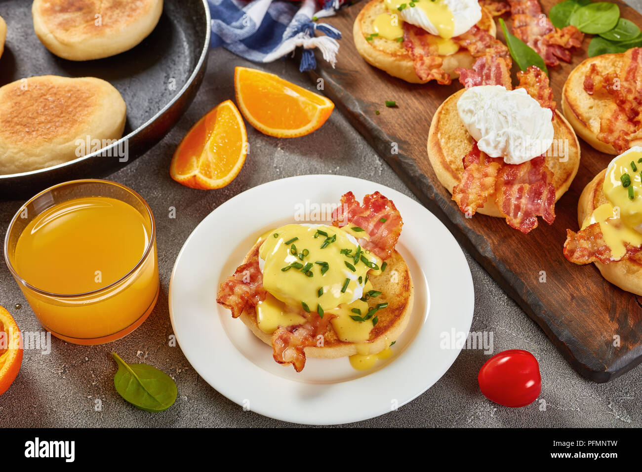 Eggs Benedict toasted English muffins, fried crispy bacon, poached