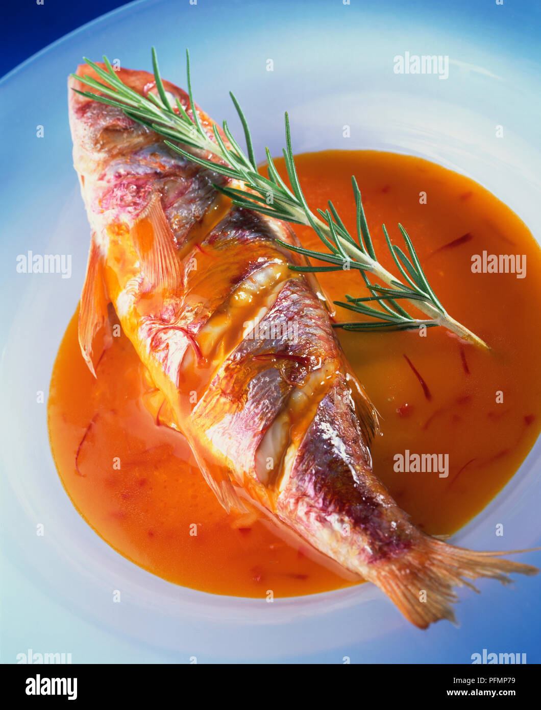 Whole red mullet in a tangy orange and saffron sauce garnished with a