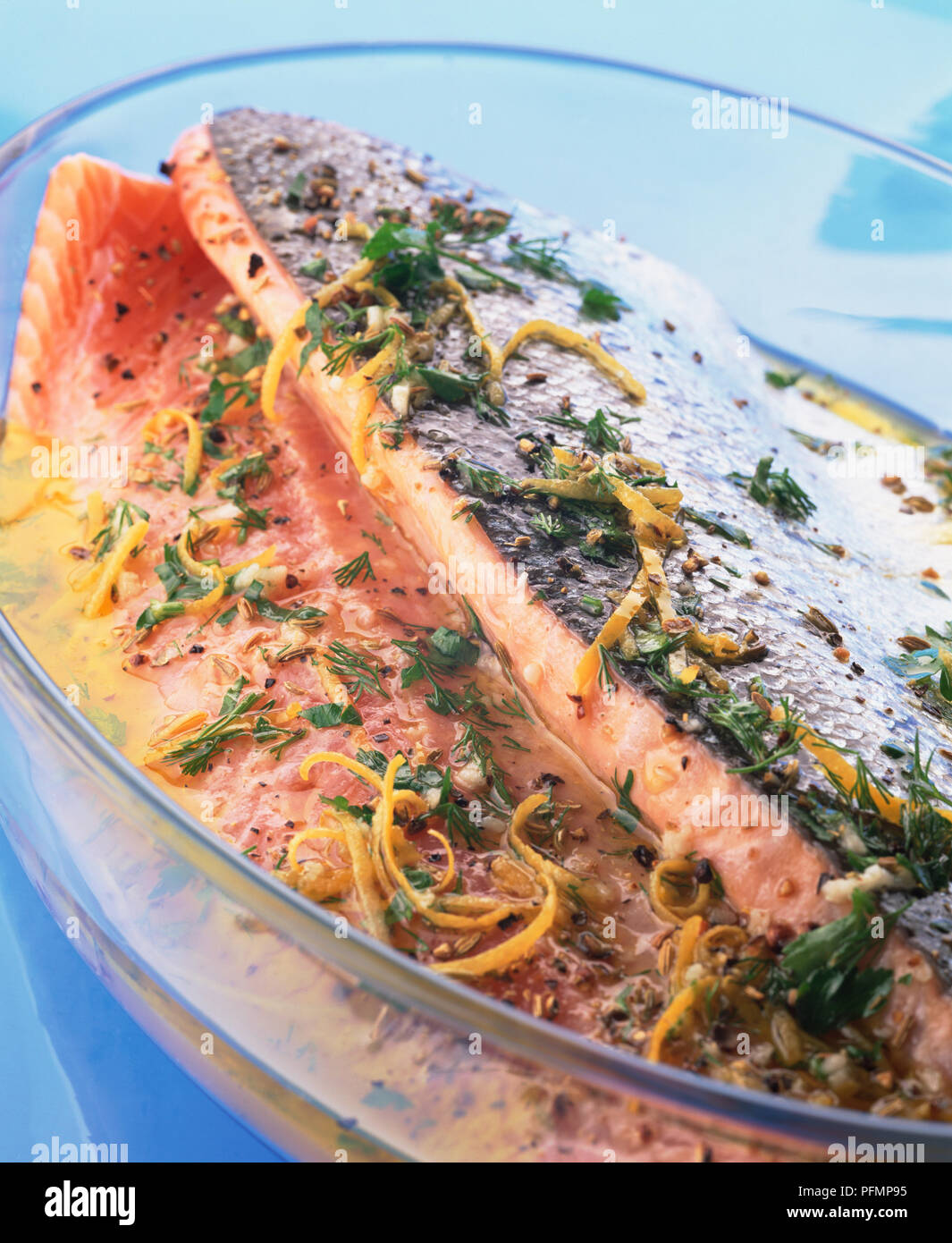 Salmon fillets in Mediterranean fish marinade of lemon rind,, dill, parsley and olive oil Stock