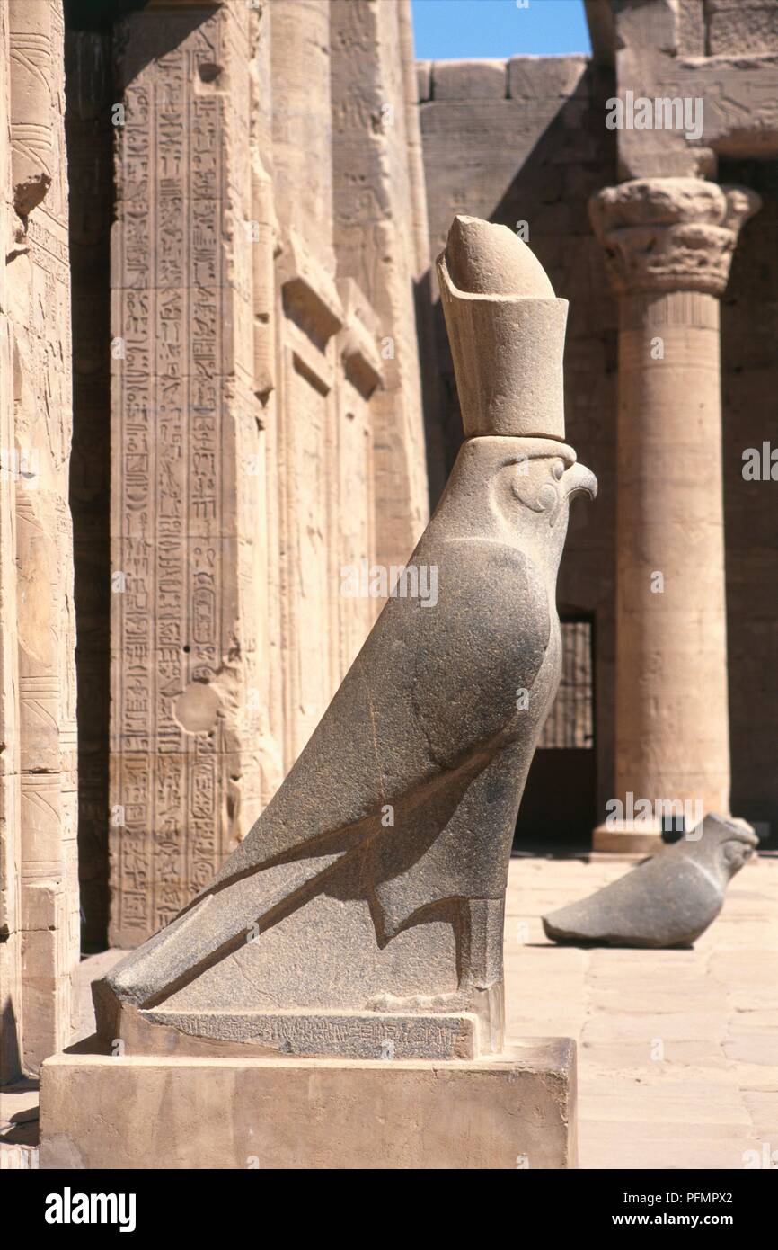 Egypt, Edfu, Temple of Horus, granite statue of the falcon god Horus, side view Stock Photo