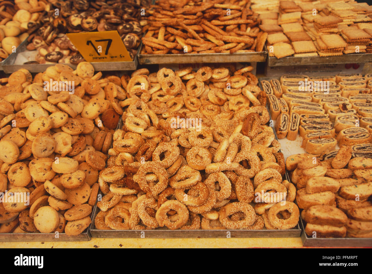 Israel, Israel, Jerusalem, Souk Kahn el-Zeit, trays filled with local pastries, high angle view. Stock Photo