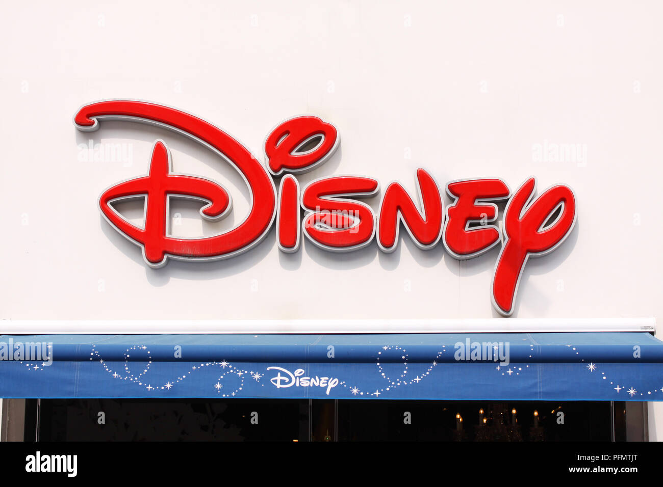 Copenhagen, Denmark - August 17, 2018: The Disney logo on sign panel at the exterior of the Disney store Stock Photo