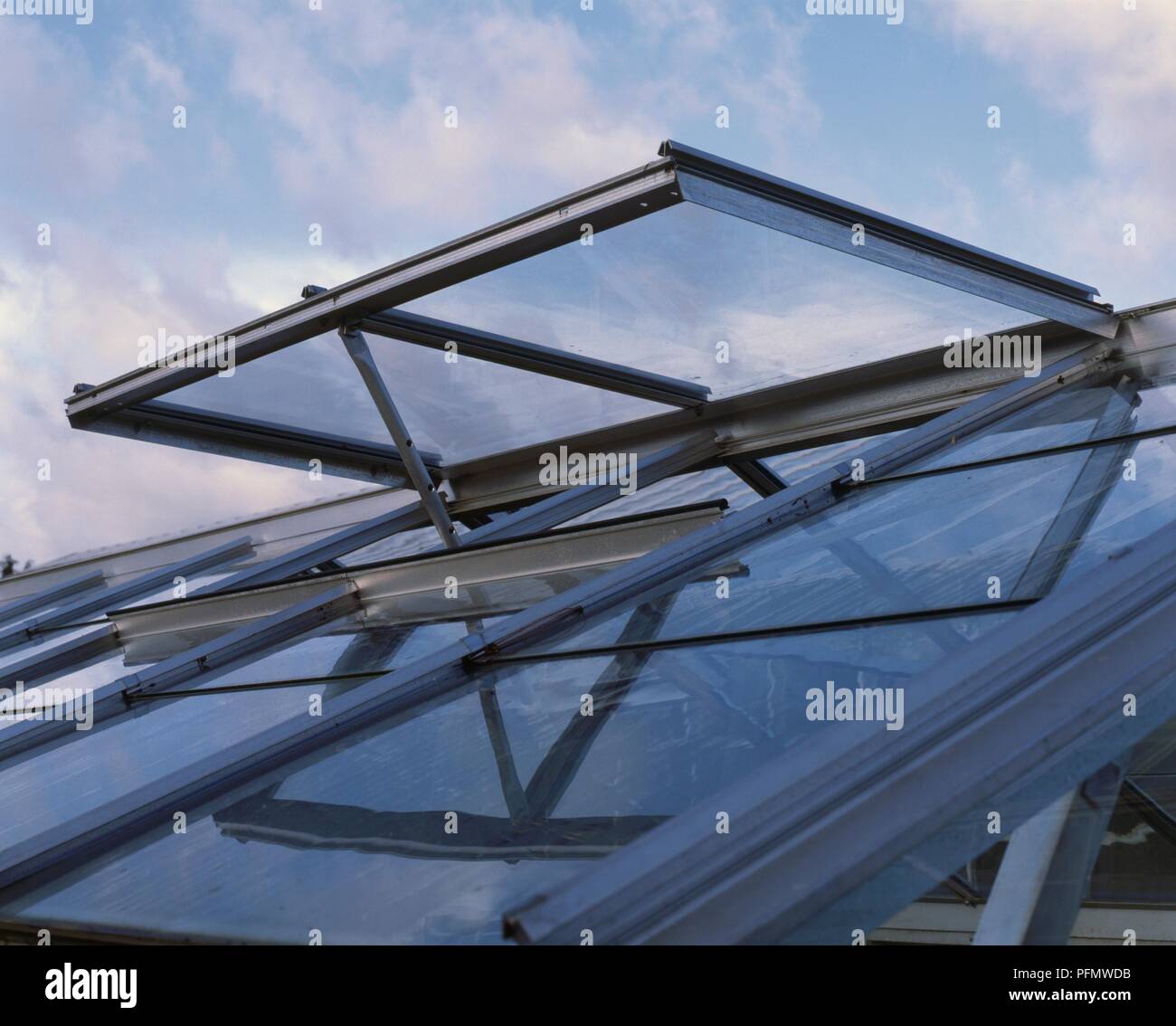 Open hinged vent on roof of domestic greenhouse Stock Photo Alamy