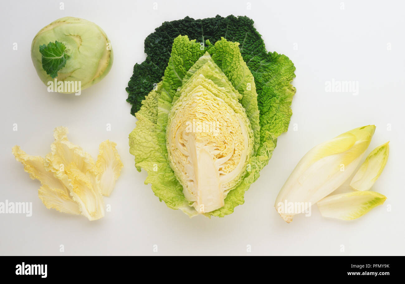 Whole Kohlrabi and sections of Savoy Cabbage, Chinese Leaf, Chicory Stock Photo