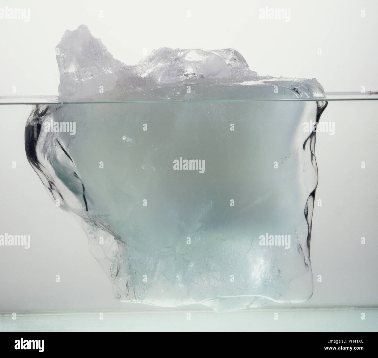 Block of ice in water. Stock Photo