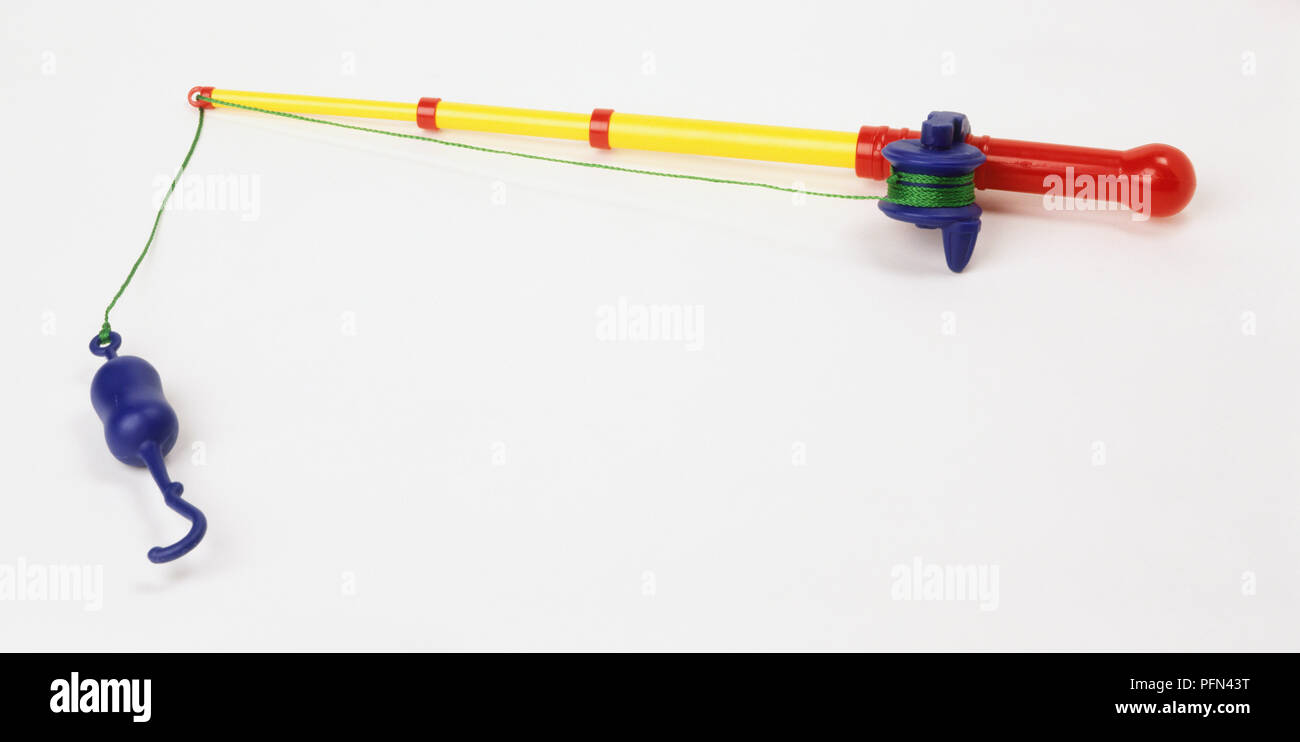 Red, green, blue and yellow toy fishing rod Stock Photo - Alamy