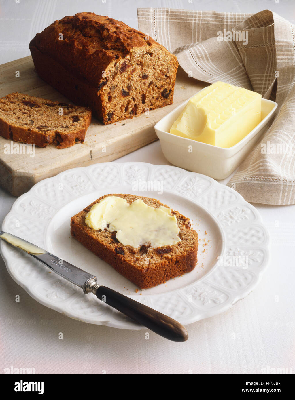 Slice Of Buttered Datenut Bread On A Plate With A Butter Knife To The Right Bread Loaf And Dish Of Butter In The Background Stock Photo Alamy Slice Of Buttered Datenut Bread On A Plate With A Butter Knife To The Right Bread Loaf And Dish Of Butter In The Background Stock Photo Alamy