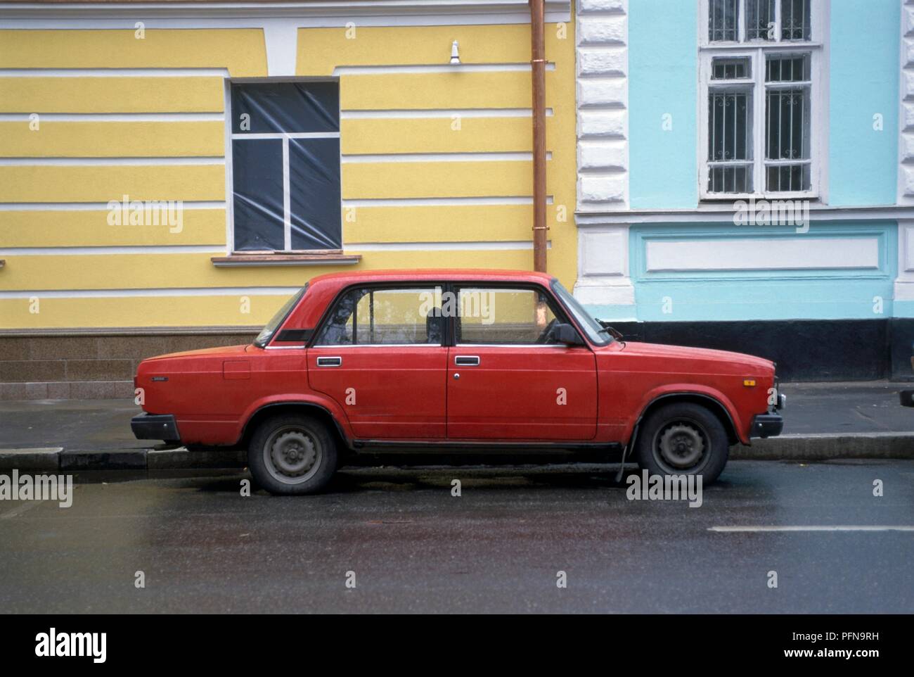 Russia, Moscow, side view of a red Lada car parked in the street Stock Photo