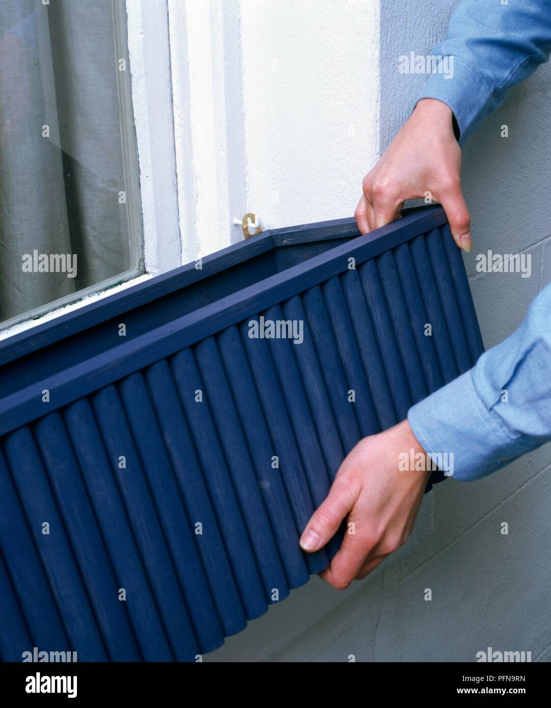 Attached to hooks hires stock photography and images Alamy