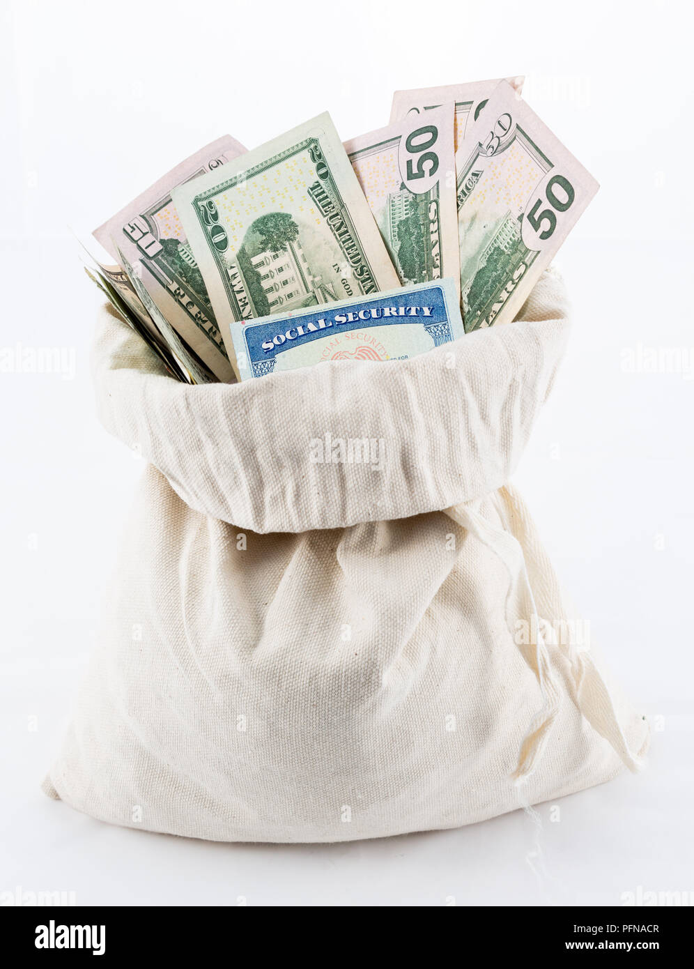 Many US dollar bills or notes in money bag with social security card Stock Photo
