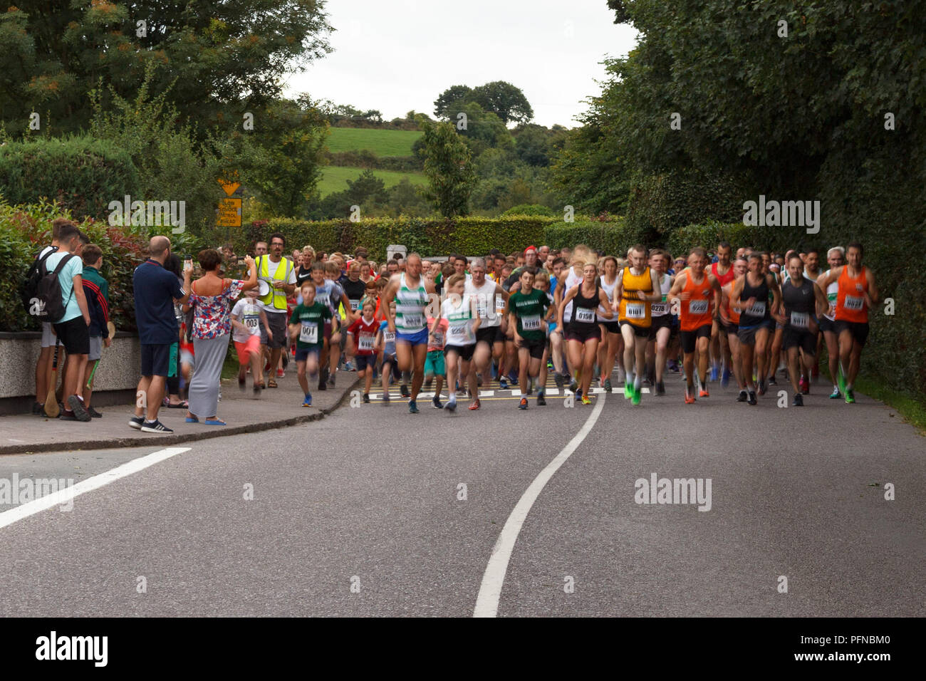 Cork, Ireland. 21th Aug, 2018.   Carrig na bhFear GAA 5K Run. The annual Carrig na bhFear GAA 5K Run took place earlier this evening. The run saw a large variety of both casual and serious runners of all ages. The runners left Carrig na bhFear primary school at 7:30 and ended back at the school for tea, coffee and refresments. The event was a great night out for all involved . Credit: Damian Coleman/Alamy Live News. Stock Photo