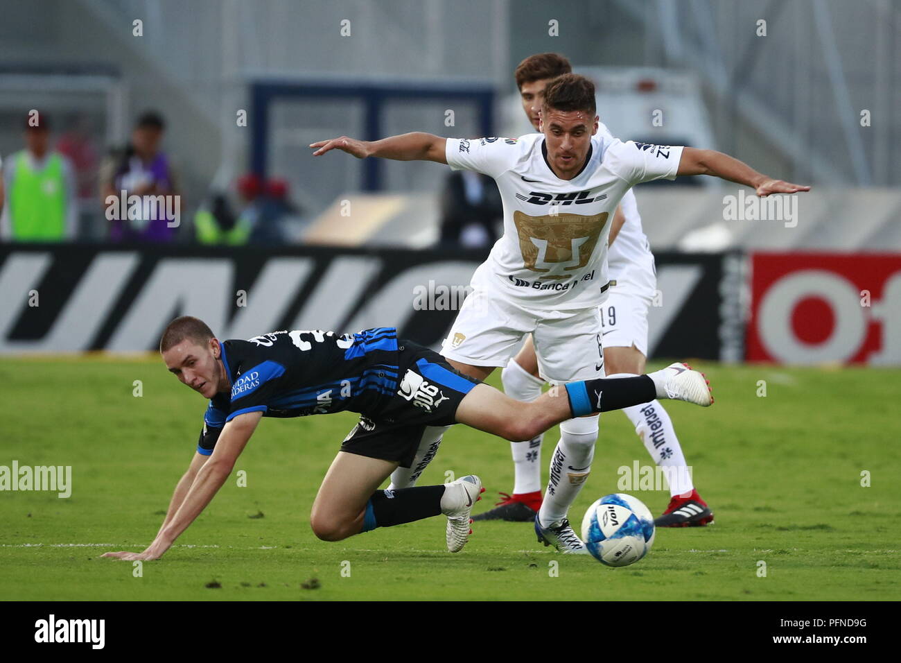 queretaro s marcel ruiz l vies for the ball with pumas kevin escamilla r during the mexican