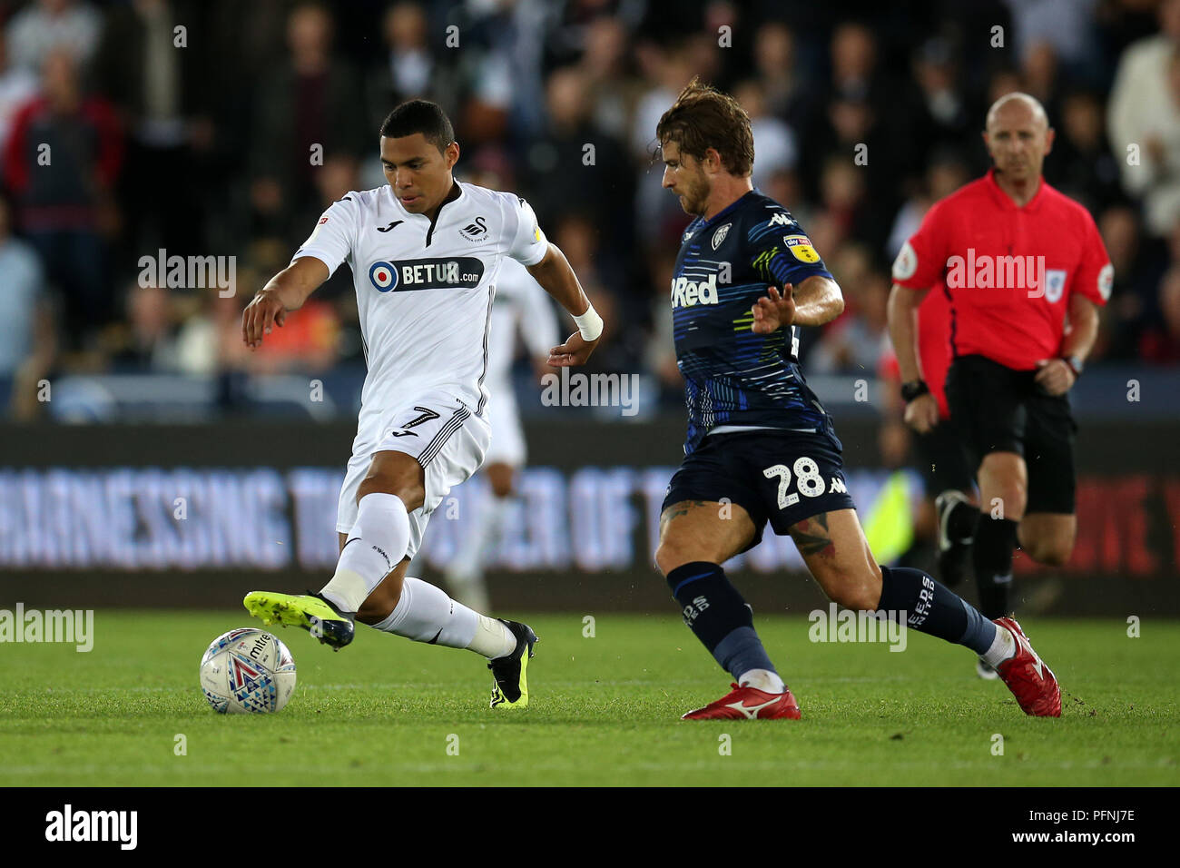 Swansea, South Wales, UK. 21st Aug, 2018. Jefferson Montero of Swansea city (l) and Gaetano Berardi of Leeds Utd in action.EFL Skybet championship match, Swansea city v Leeds Utd at the Liberty Stadium in Swansea, South Wales on Tuesday 21st  August 2018.  this image may only be used for Editorial purposes. Editorial use only, license required for commercial use. No use in betting, games or a single club/league/player publications. pic by Andrew Orchard/Andrew Orchard sports photography/Alamy Live news Stock Photo