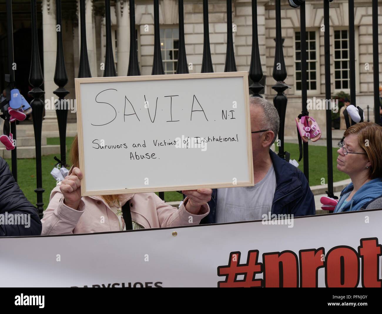 Belfast, Northern Ireland, UK. 22 August 2018. Survivors and Victims of Clerical and Institutional Abuse (SAVIA) held a protest at Belfast City Hall calling for an apology from the Vatican for historical child abuse. The group was joined by other victims and survivors. Pope Francis will visit Ireland over 25th and 26th August but will not visit Northern Ireland. Credit J Orr/Alamy Live News Stock Photo