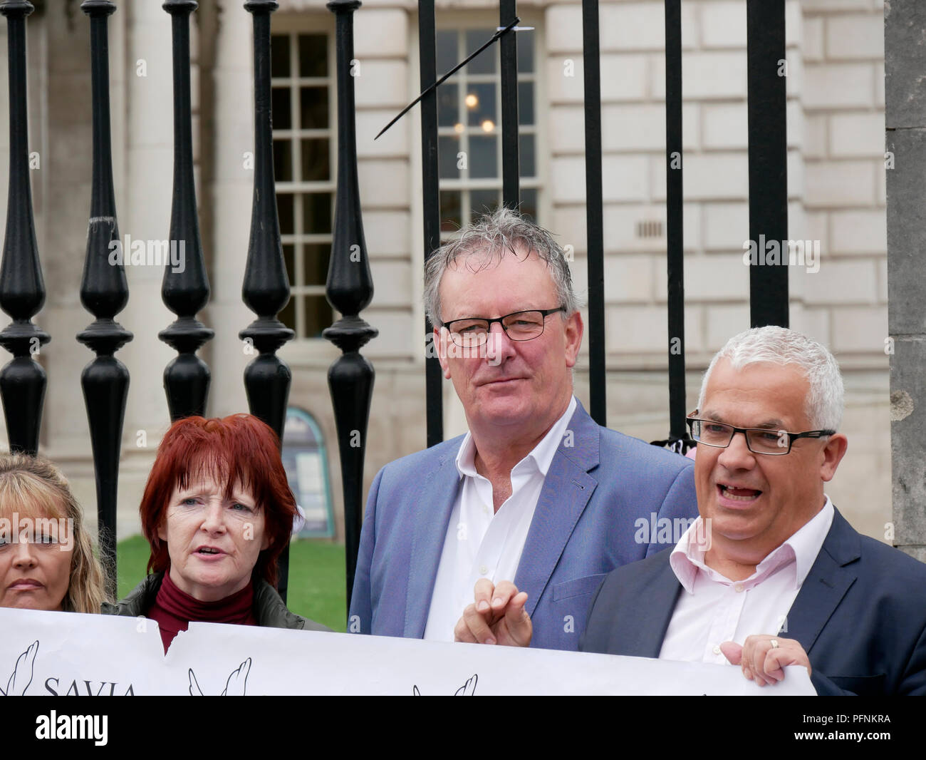 Belfast, Northern Ireland, UK. 22 August 2018. Survivors and Victims of Clerical and Institutional Abuse (SAVIA) held a protest at Belfast City Hall calling for an apology from the Vatican for historical child abuse. The group was joined by other victims and survivors. Pope Francis will visit Ireland over 25th and 26th August but will not visit Northern Ireland. Mike Nesbitt MLA with protesters. Credit J Orr/Alamy Live News Stock Photo