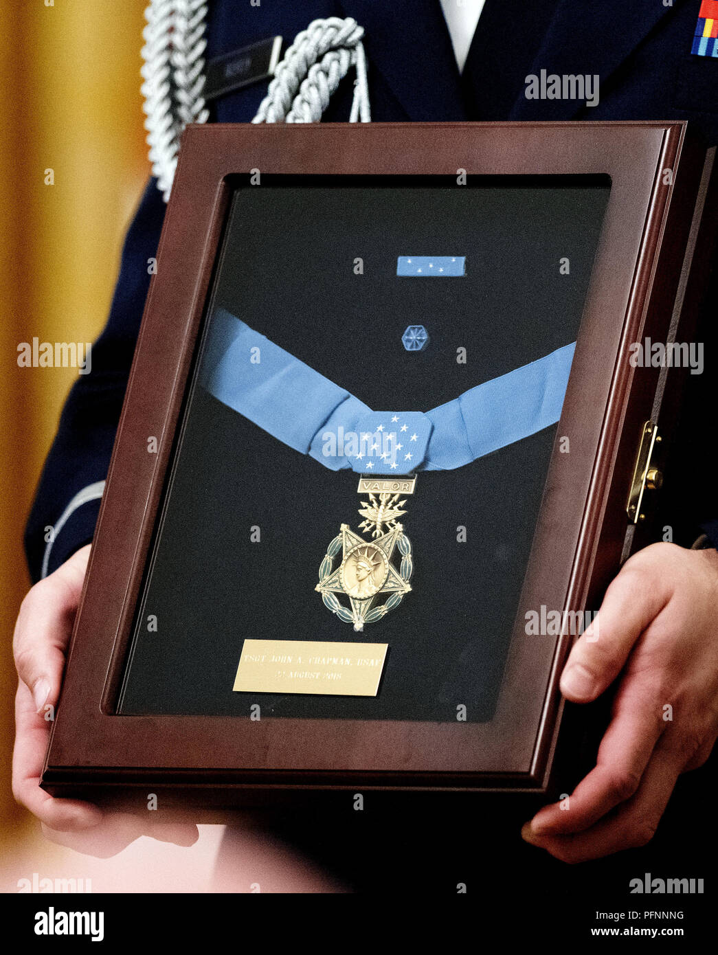 Washington, District of Columbia, USA. 22nd Aug, 2018. Close-up of the Congressional Medal of Honor that is being awarded posthumously to Technical Sergeant John A. Chapman, United States Air Force by US President Donald J. Trump during a ceremony in the East Room of the White House in Washington, DC on Wednesday, August 22, 2018. Sergeant Chapman is being honored for his actions on March 4, 2002, on Takur Ghar mountain in Afghanistan where he gave his life to save his teammates Credit: Ron Sachs/CNP/ZUMA Wire/Alamy Live News Stock Photo