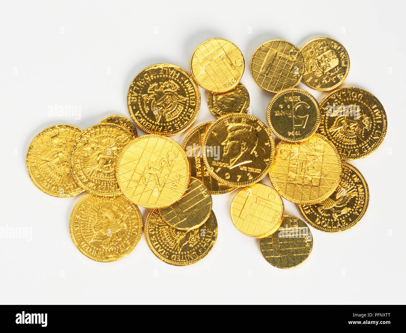 Chocolate coins wrapped in gold Stock Photo Alamy