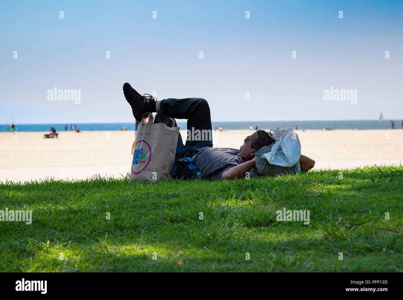 Man relaxing by the Beach in California Stock Photo