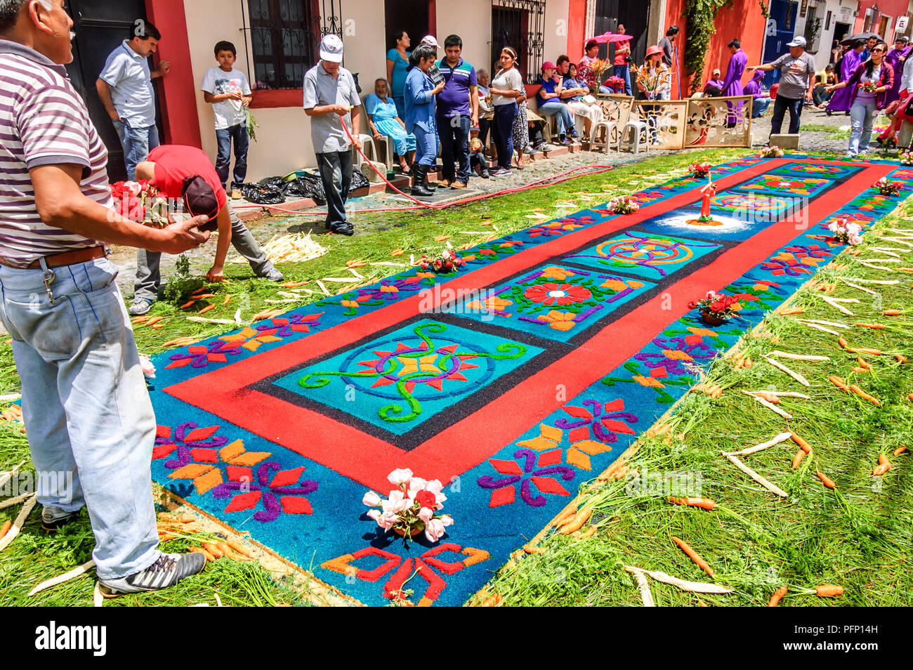 Antigua, Guatemala -  March 15, 2015: Making Lent procession carpet in UNESCO World Heritage Site with famous Holy Week celebrations. Stock Photo