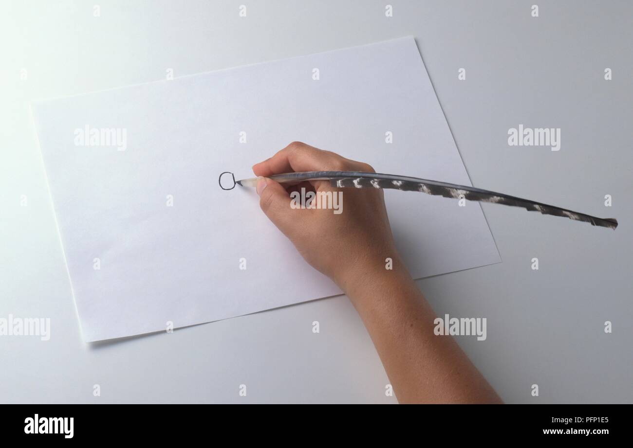 Hand using quill pen, closeup Stock Photo Alamy