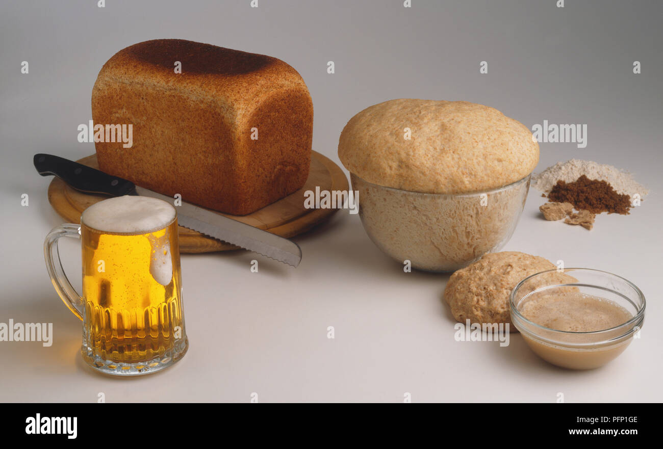 Yeast dough at different stages of preparation, glass of beer, bread ...