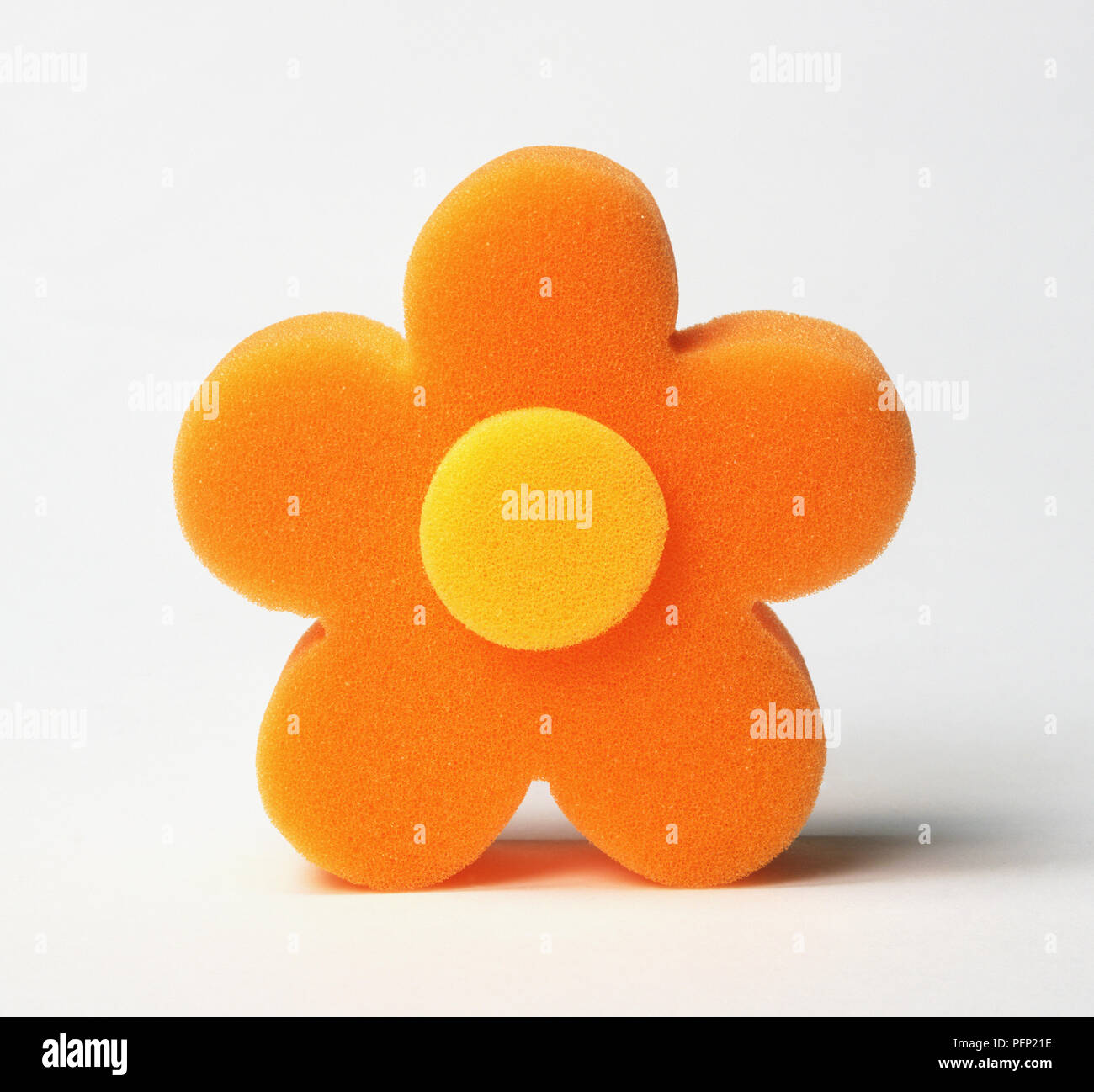 Orange and yellow sponge in shape of flower Stock Photo