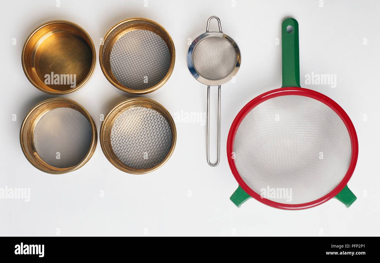 Food sieve, tea strainer, metal seed sieves and bowl Stock Photo Alamy