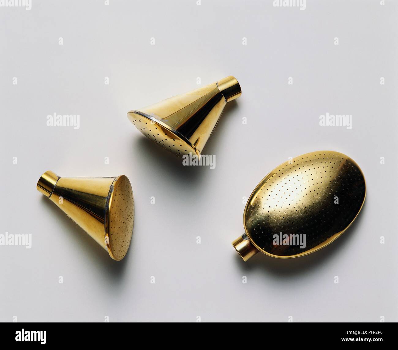 Three brass watering can spouts Stock Photo Alamy