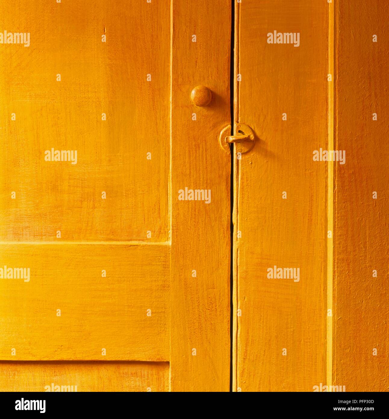 Yellow wooden door with latch, closeup Stock Photo Alamy