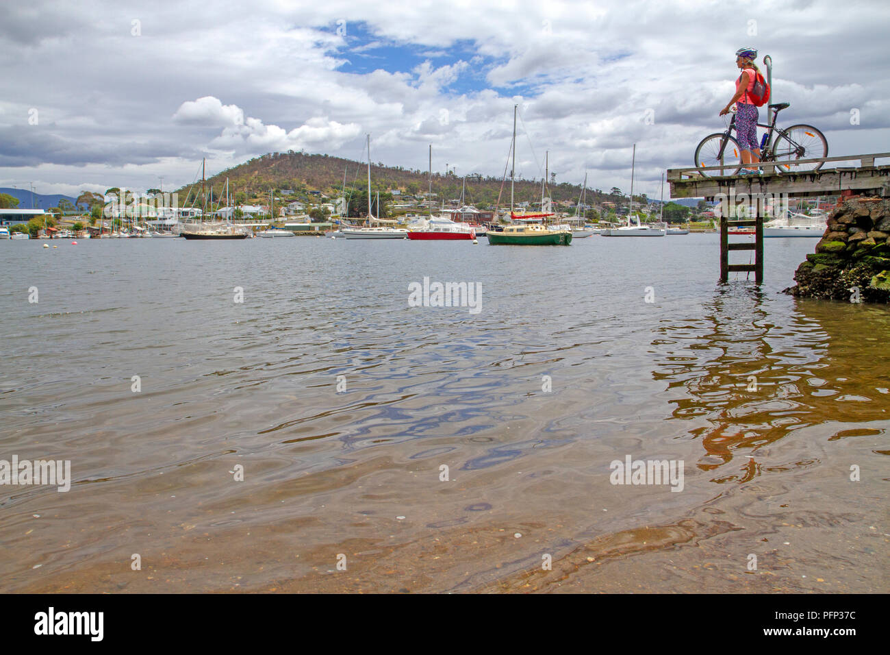 Cyclist on the Clarence Foreshore Trail in Hobart Stock Photo