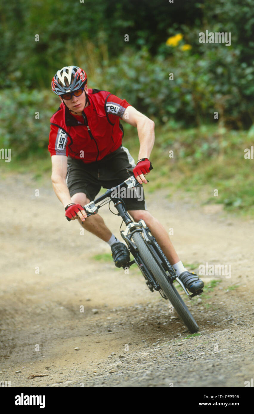Cycle Rider Lean Male cyclist, coutry track, leaning bike to make turn Stock Photo - Alamy