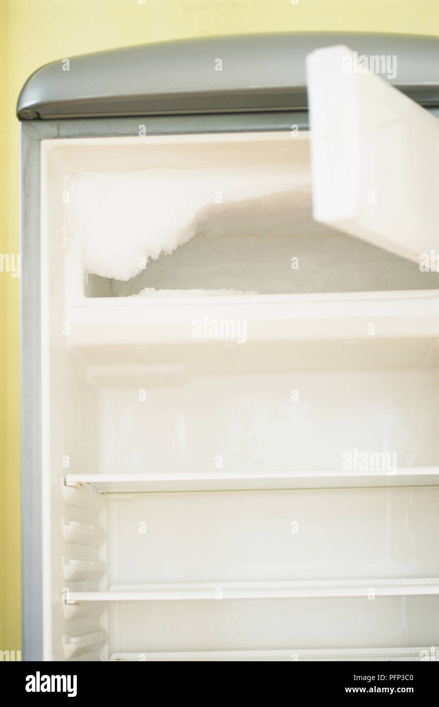 Buildup of ice in freezer compartment Stock Photo Alamy