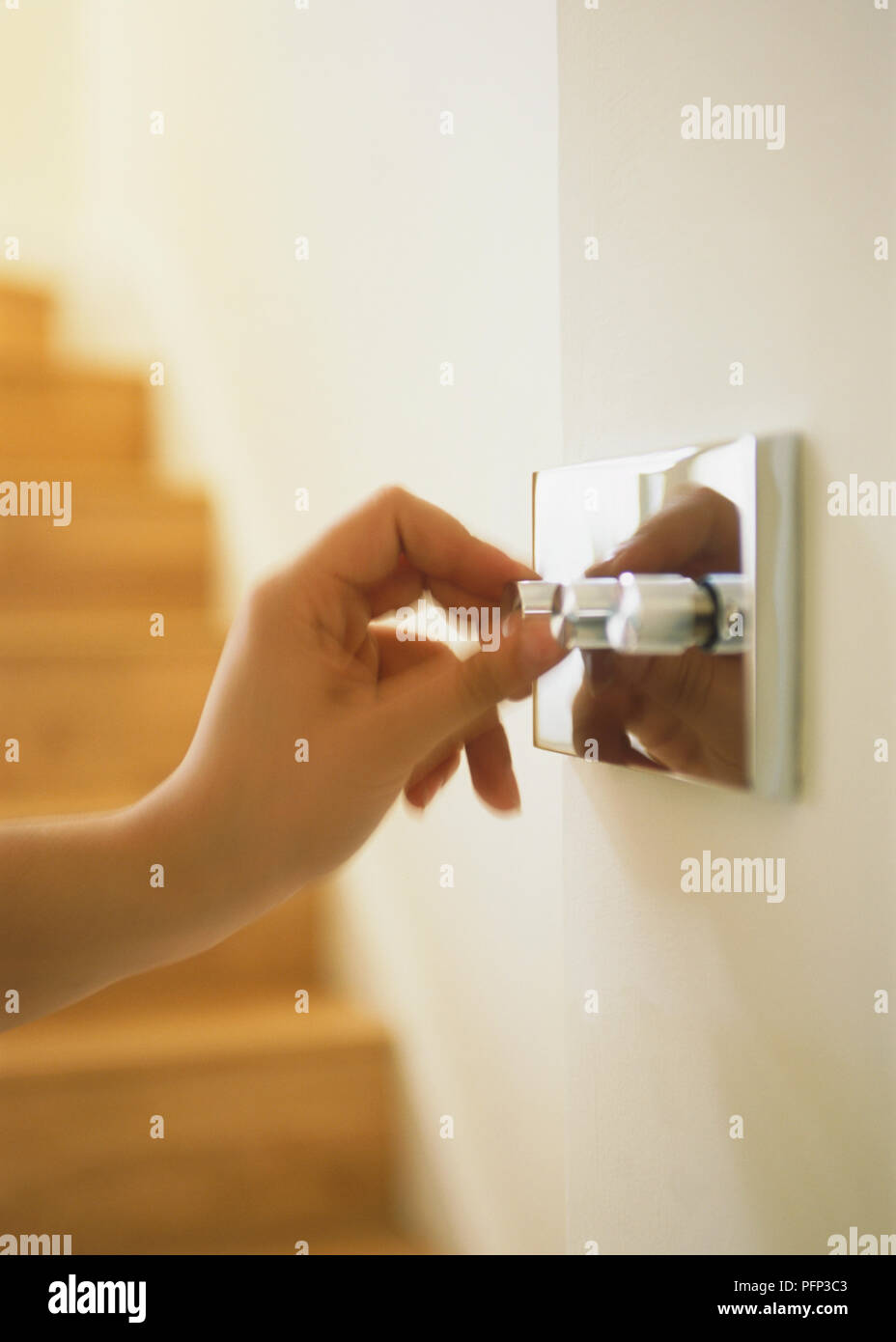 Using dimmer mechanism on light switch, blurred motion Stock Photo Alamy