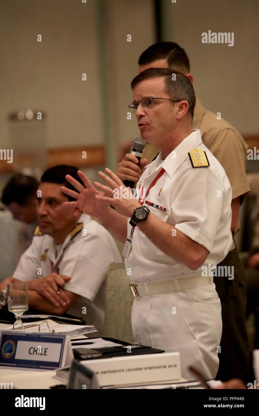 Chilean Marine Corps Rear Adm. Pedro Abrego Martinez, commanding general, Chilean Marine Corps, asks a question during the Pacific Amphibious Leaders Symposium (PALS) 2018 in Honolulu, Hawaii, May 22, 2018. PALS brings together senior leaders of allied and partner militaries with significant interest in the security and stability of the Indo-Pacific region to discuss key aspects of maritime/amphibious operations, capability development, crisis response, and interoperability. Stock Photo