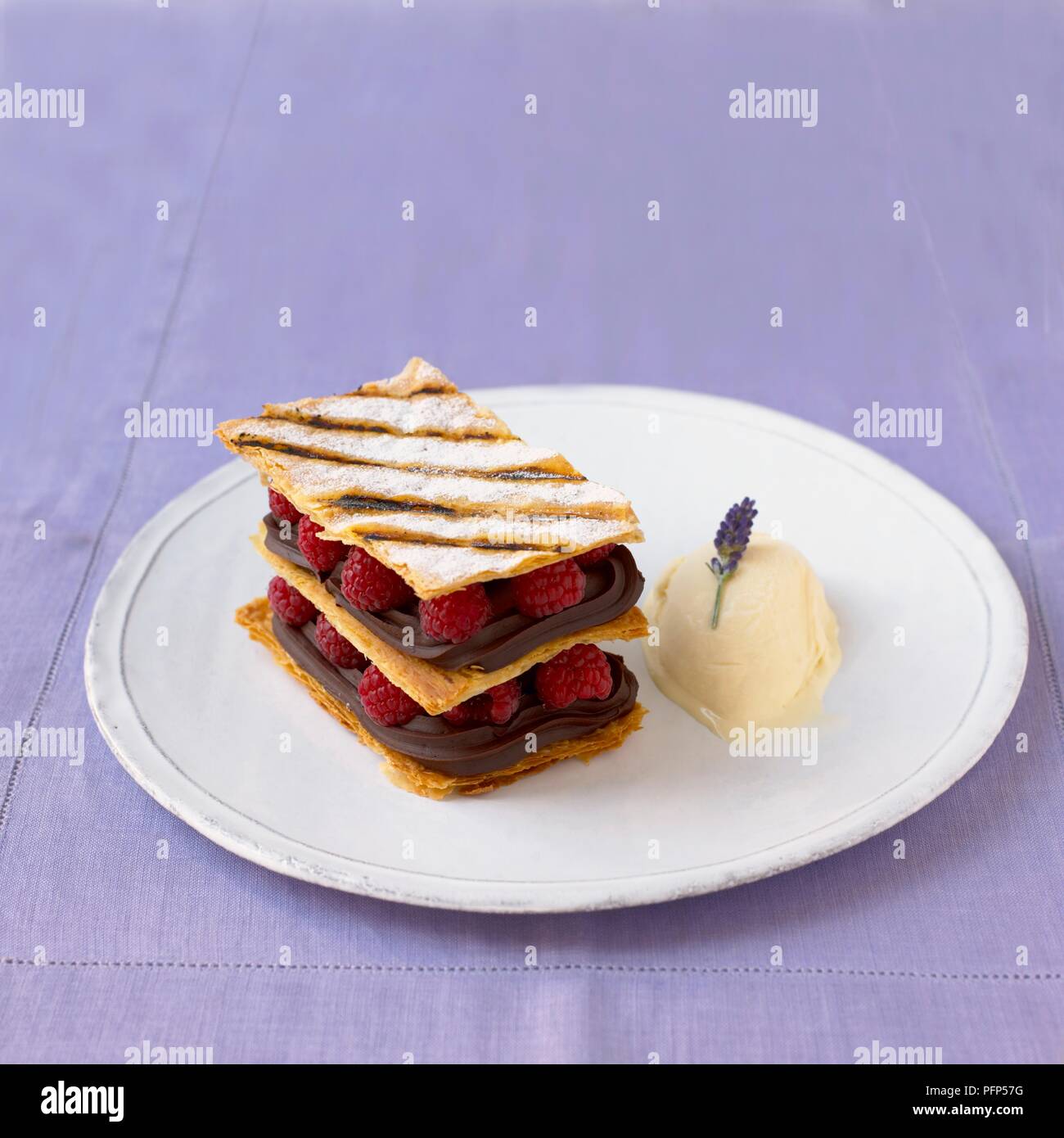 Mille Feuille served on white plate with cream Stock Photo