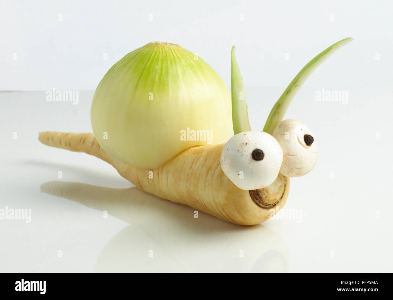 Snail made from raw onions, mushrooms and parsnips Stock Photo Alamy