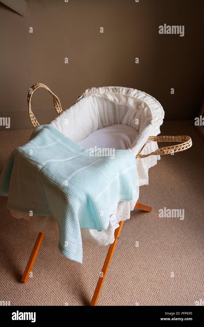Soft blue blanket on top of Moses basket Stock Photo