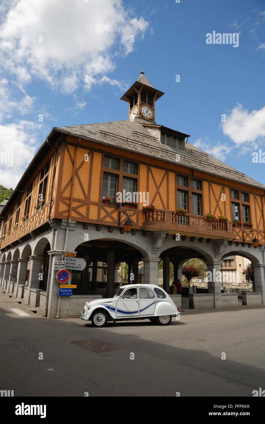 France, Arreau, Citroen 2CV on road next to medieval covered market Stock Photo