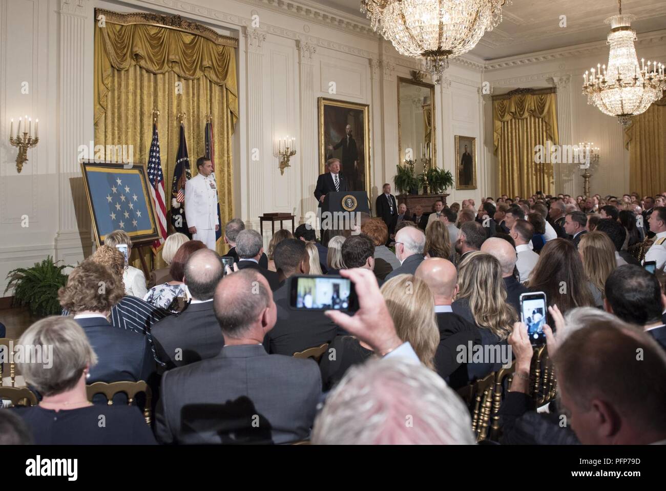 (May 24, 2018) President Donald J. Trump delivers remarks during the Medal of Honor ceremony in honor of retired Master Chief Special Warfare Operator (SEAL) Britt Slabinski at the White House in Washington, D.C. Slabinski received the Medal of Honor for his actions during Operation Anaconda in Afghanistan in March 2002. Stock Photo