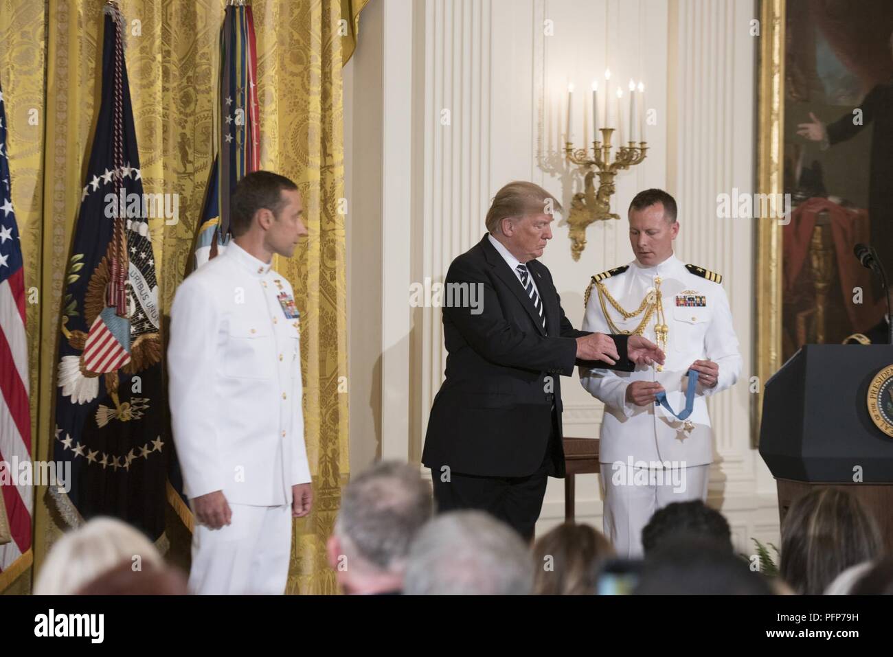 (May 24, 2018) President Donald J. Trump presents the Medal of Honor to retired Master Chief Special Warfare Operator (SEAL) Britt Slabinski during a ceremony at the White House in Washington, D.C. Slabinski received the Medal of Honor for his actions during Operation Anaconda in Afghanistan in March 2002. Stock Photo
