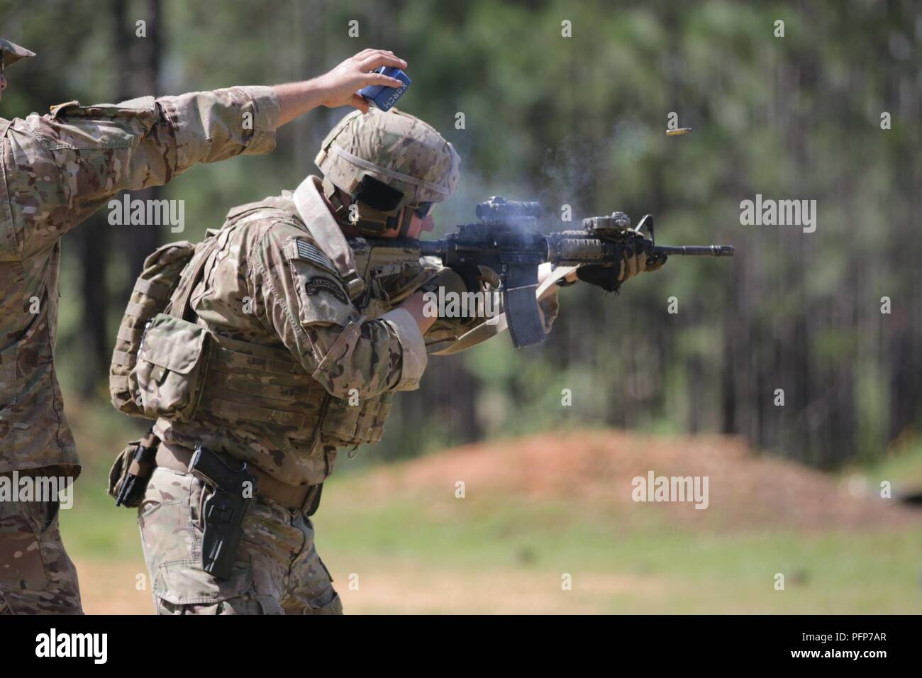 Staff Sgt. Justin Danforth, a Denver, Colorado-native and infantryman assigned to Company A, 1st Battalion, 325th Airborne Infantry Regiment, 2nd Brigade Combat Team, 82nd Airborne Division, fires an M4 Carbine during the last day of the Small Arms Competition as part of All American Week XXIX at Fort Bragg, North Carolina, May 23, 2018.  Paratroopers past and present converged on the center of the military universe to celebrate being members of the “All American” Division and America’s Guard of Honor. Stock Photo