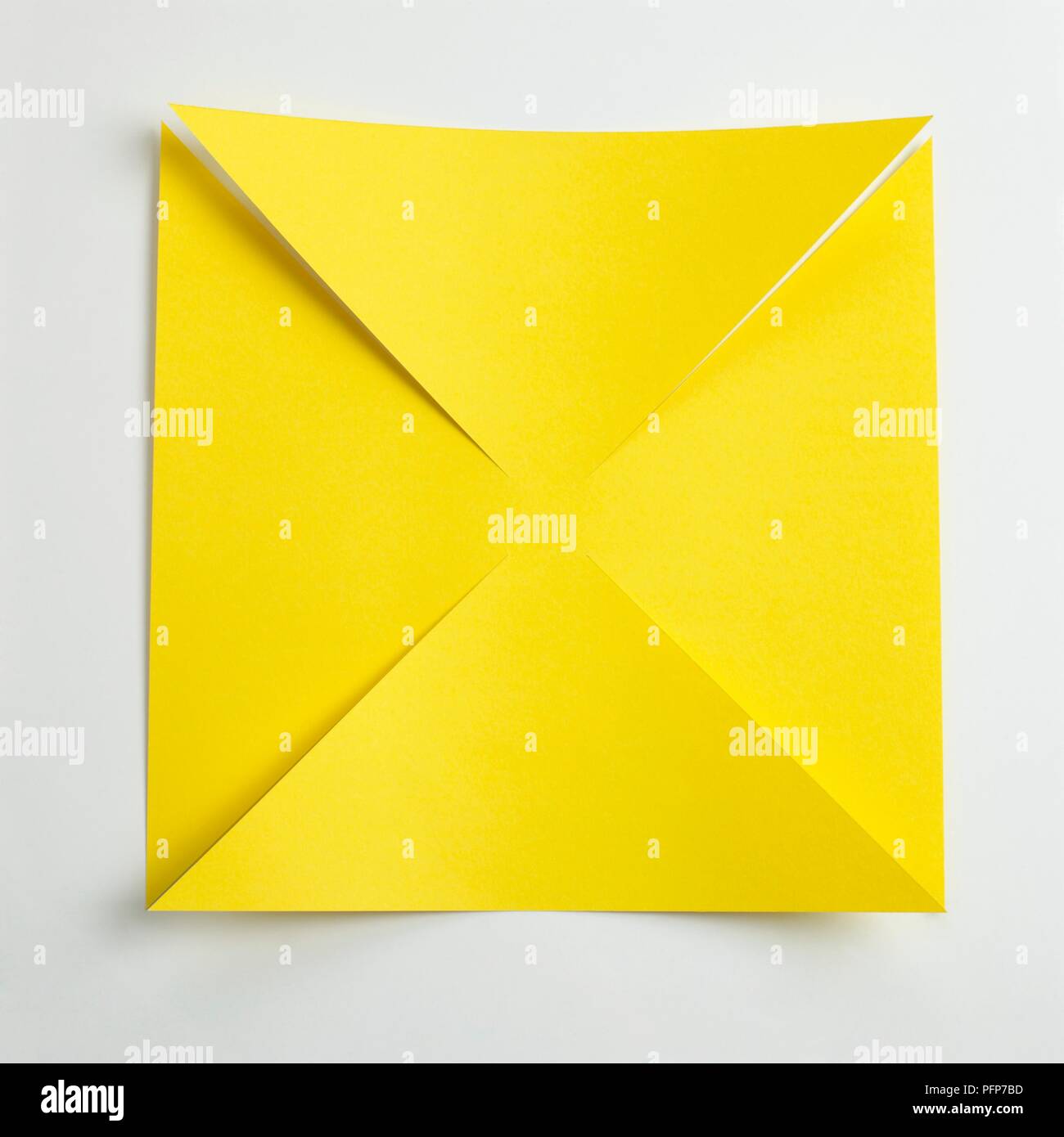 Download Square Yellow Paper Cut Into Triangle Shapes Making Paper Windmill Stock Photo Alamy PSD Mockup Templates