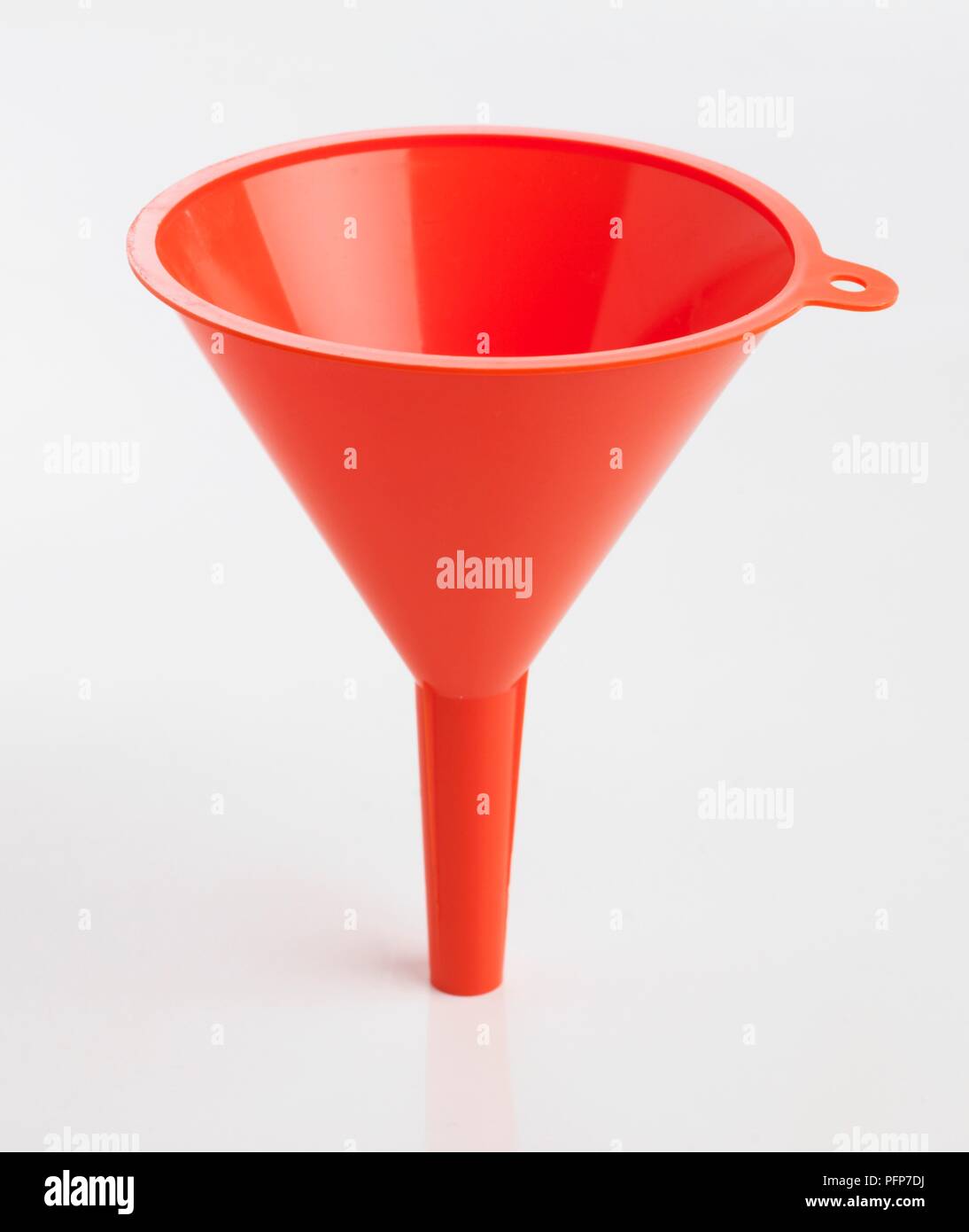 Red plastic funnel Stock Photo