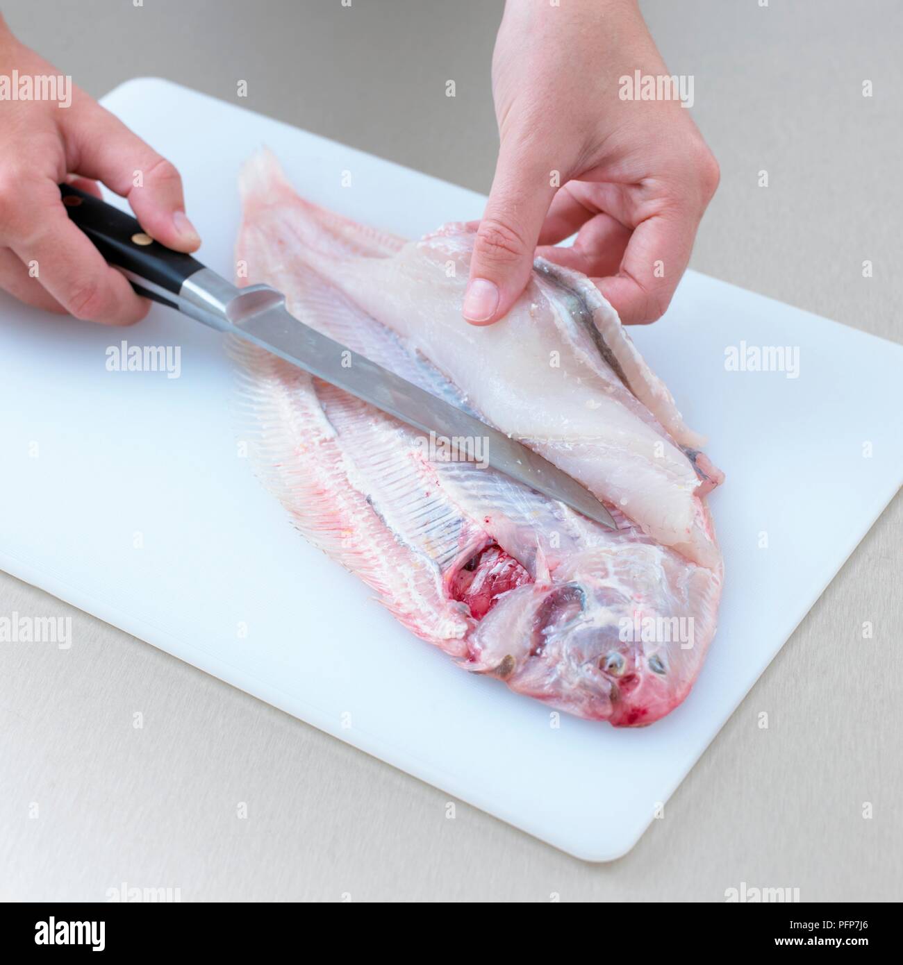 filleting fish with knife