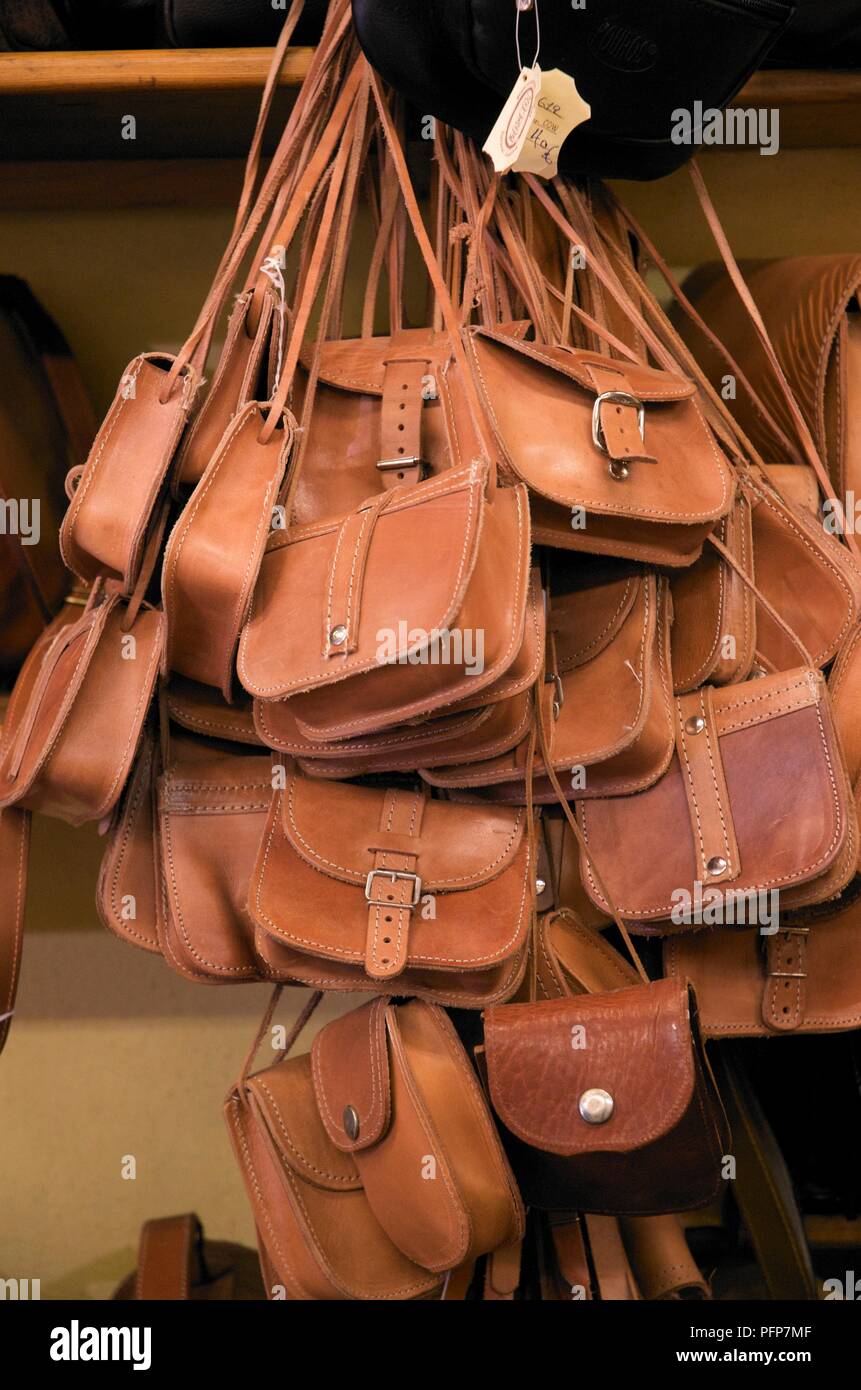 Greece, handmade leather handbags hanging on market stall Stock Photo -  Alamy